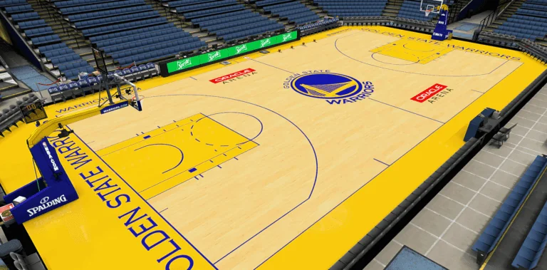 Arena basketball court with a yellow painted key and center logo, showing standard court markings