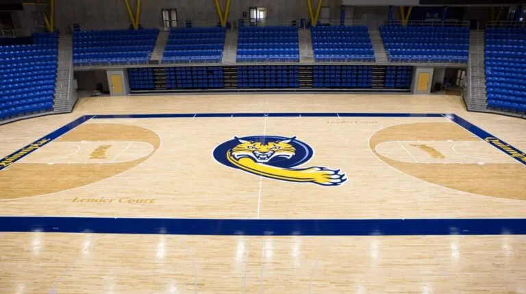 Quinnipiac University Bobcats court with a refinished maple floor and blue bleachers
