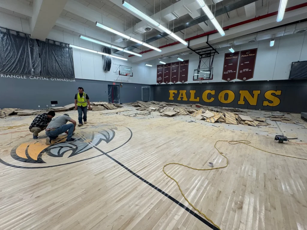J and J team pulling up the old Falcons gym floor