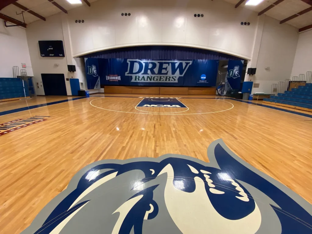 Drew Rangers mid-court logo on a glossy maple gym floor