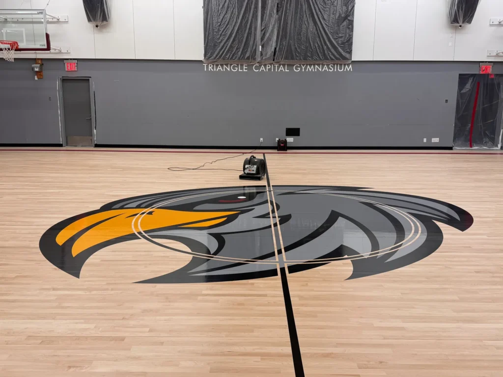 After: the Falcons gym with its new maple floor and eagle center court logo