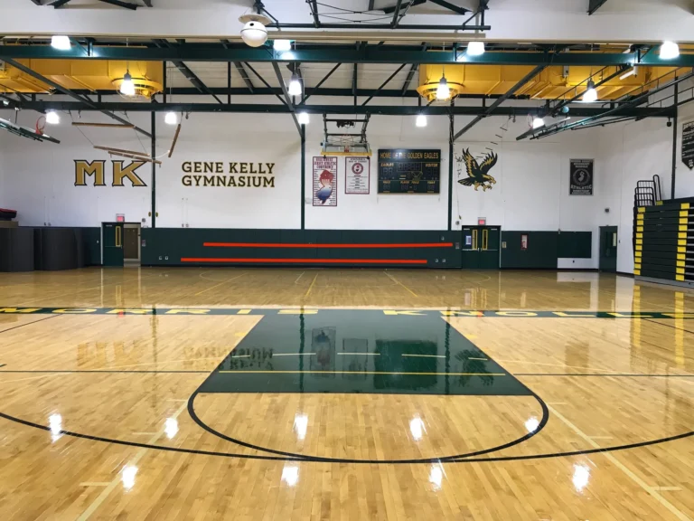 Gene Kelly Gymnasium maple gym floor with green painted keys and a glossy finish