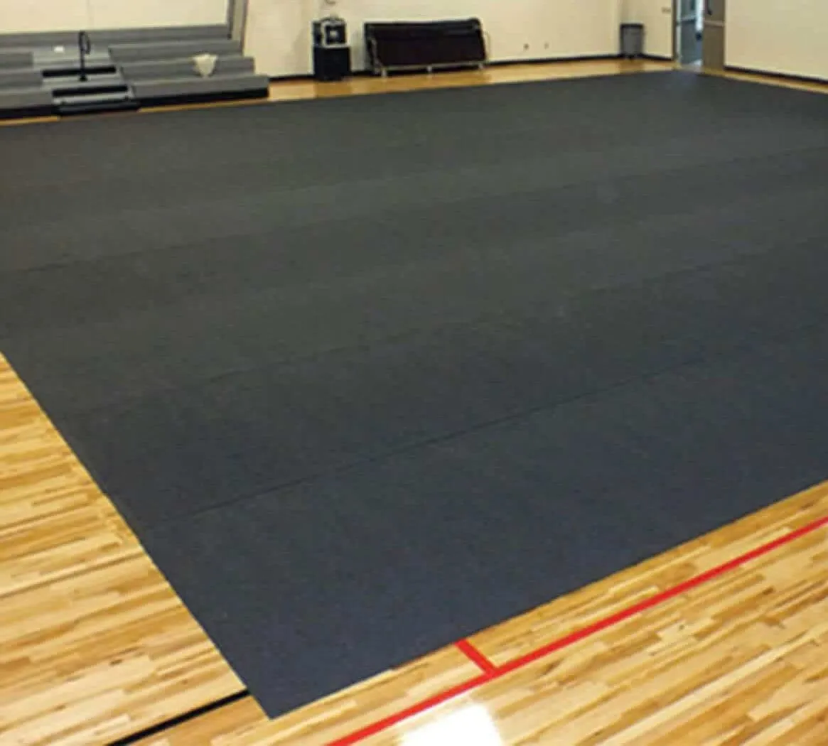 Gym floor cover rolls rolled out across a school gym floor