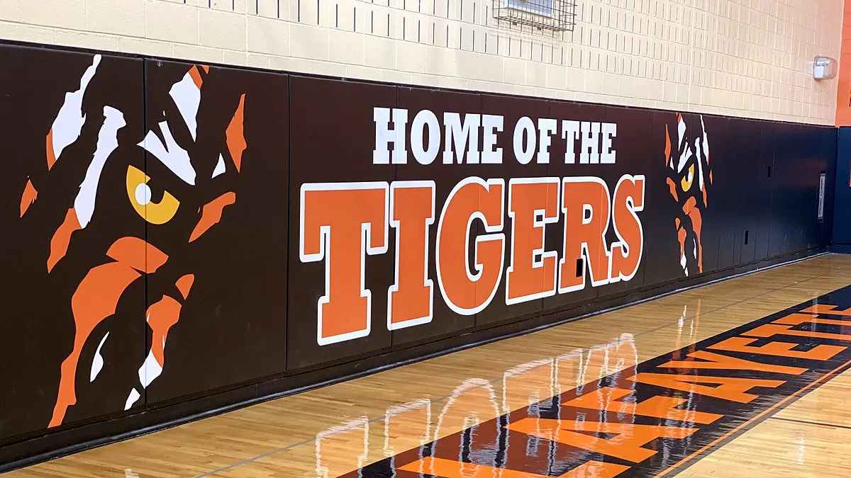 Black and orange Home of the Tigers custom printed gym wall pads with tiger artwork