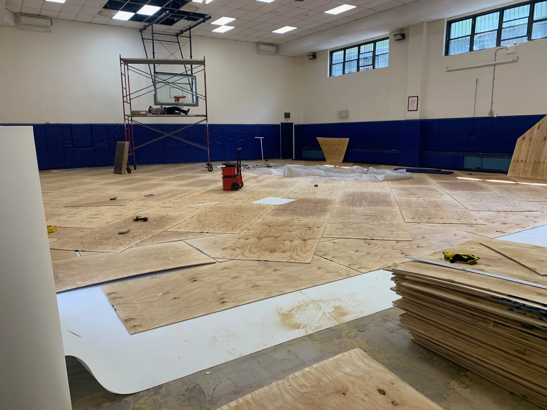 New gym floor installation in progress, with subfloor going down over the slab